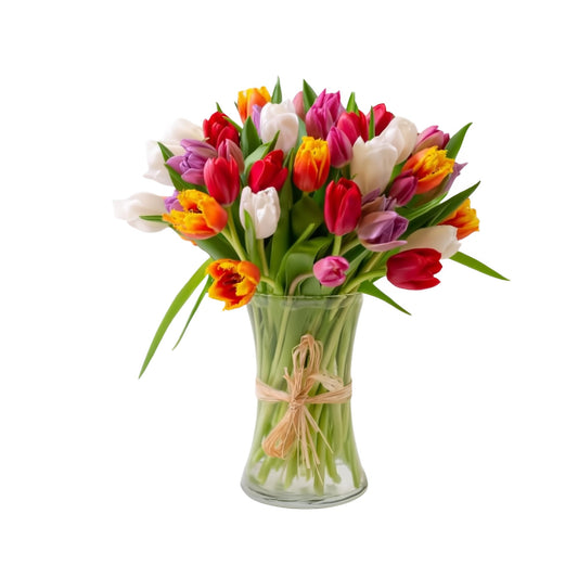 Birthday Tulips in our hand-designed bouquet are picked fresh, then arranged inside a clear vase by Queens Flower Delivery.